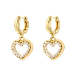 Close-up of golden hoop earrings with pearl-lined heart pendants on a white background