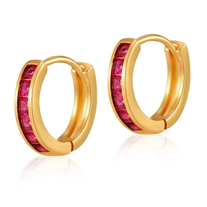 Detailed macro view of 18K gold hoop earrings featuring vibrant red square gemstones