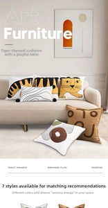 Detailed view of modern towel embroidery cushions with tiger and geometric patterns