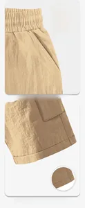 Detail of drawstring waistband and breathable moisture-wicking fabric on beige cargo pants
