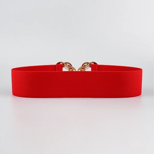Close-up of a red elastic waist belt with an elegant gold chain buckle decoration