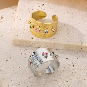 Irregular wide band hammer rings in gold and silver with colorful zircon gemstones
