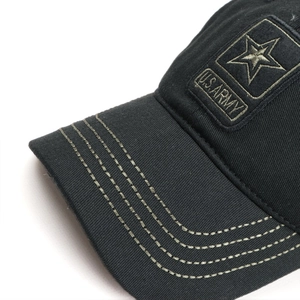 Detail of U.S. ARMY embroidery and star patch on black cotton camouflage baseball cap
