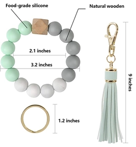 Detail view of silicone bead keychain with food-grade material and natural wood beads