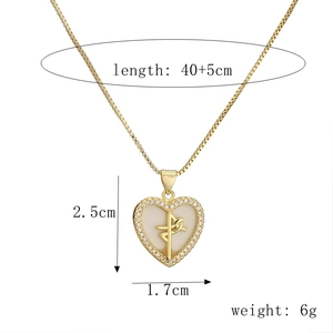 Detail showing dimensions of the gold heart pendant necklace with cross and zircons