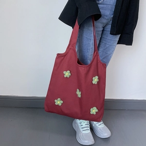 Maroon canvas tote bag featuring green 3D knitted flower decorations for a vintage style
