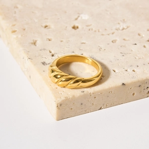 18k gold plated stainless steel croissant ring with a twisted dome design on stone