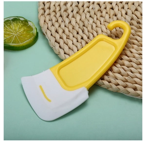 Macro detail of a dual-color silicone scraper with flexible white edge and hanging hole