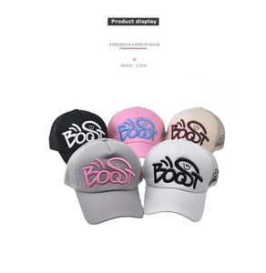 Close-up of vintage washed cotton baseball caps with 3D BOOST embroidery and mesh back