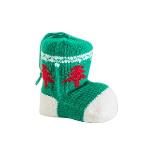 Knitted green Christmas boot ornament with red tree pattern and white hanging loop
