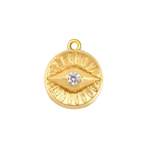 Macro view of gold-plated evil eye pendant with sparkling cubic zirconia inlay