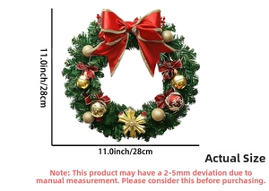 Detail of Christmas wreath with red bows, golden ornaments, and faux pine needles