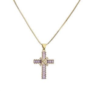 Gold plated cross necklace with vibrant purple cubic zirconia stones on white background