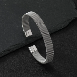 Minimalist 10mm stainless steel mesh wire cuff bracelet with magnetic clasp on slate