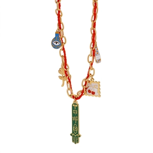 Detail of colorful Hamsa and elephant charms on a red woven stainless steel necklace