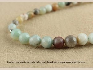 Close-up of natural agate and turquoise beads with unique textures on a wrist strap