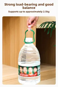 Pink S-shaped clothes hanger hook showing strong load-bearing capacity with a large bottle