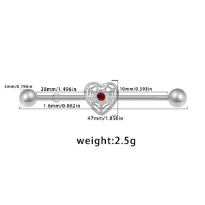 Detail view of heart-shaped industrial barbell with red zircon and exact size dimensions