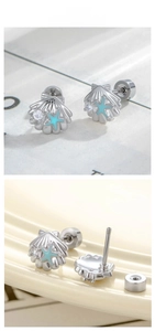 Detail of seashell screw-back stud earring with micro-set zircon and light blue starfish