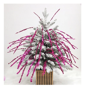 Tabletop flocked Christmas tree with bright pink sequin branches and a striped square base