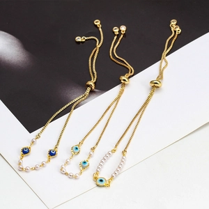 Braccialetti regolabili con occhio del male, catene dorate e perle eleganti
