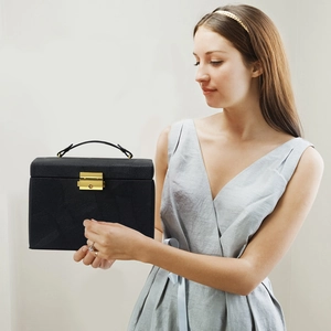 Three-layer black leather jewelry organizer box with golden lock and handle for storage