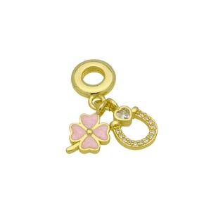 Detail of pink four-leaf clover and horseshoe charm with gold finish and tiny crystals