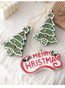 Christmas tree ornaments and Merry Christmas sign set on warm winter fabric