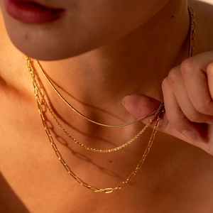 Three-layer gold titanium steel necklace featuring snake, glitter and paperclip chains