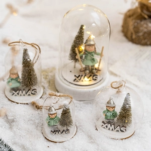 LED lighted glass dome Christmas ornament with miniature winter figures and XMAS sign