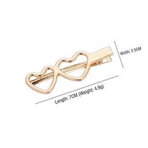 Minimalist gold heart-shaped metal hair clip with measurements 7cm length and 2.5cm width