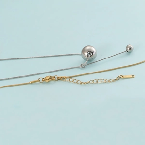 Elegant stainless steel necklace set with silver bead pendants and golden chain details