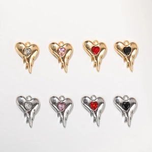 Melting heart alloy pendants with colorful glass rhinestones in gold and silver finishes