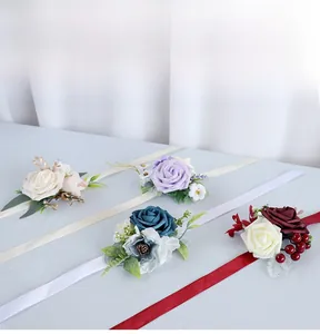 Detail of four artificial rose corsages with silk ribbons for bridal and bridesmaid wear