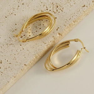 Minimalist 18k gold plated stainless steel multi-layered oval earrings on a stone base
