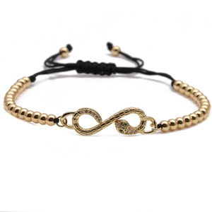 Golden and black woven adjustable bracelet with a zircon snake infinity charm