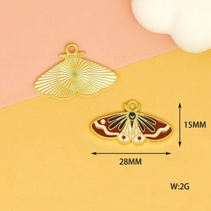 Detailed view of 28mm butterfly charms with brown enamel and gold plating for DIY crafts