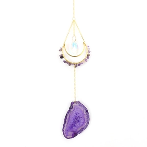 Detailed view of purple agate slices with crescent moon metal frame suncatcher
