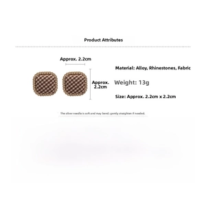 Close-up of square houndstooth fabric earrings with rhinestone border measuring 2.2cm