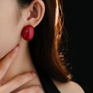 Elegant glossy red oval stud earrings with minimalist aesthetic for women in retro style