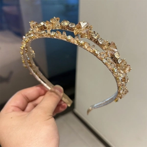 Detailed close-up of handmade double-layered headband with luxury champagne crystals