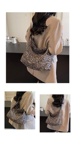 Detail of a large leopard print canvas tote bag showing soft silhouette and spacious design