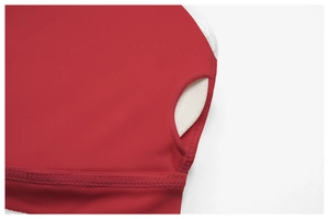 Detail of red yoga bra featuring removable padding design and reinforced stitching