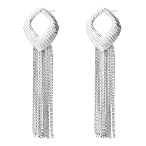 Macro detail of geometric silver tassel earrings with delicate hanging chains