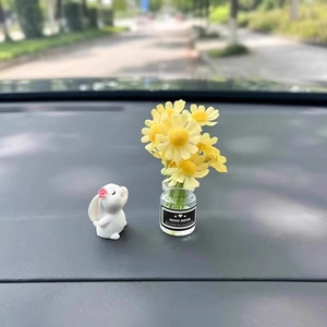 Cute white bunny figurine and mini glass vase with yellow daisies for car dashboard decor