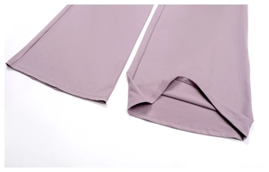 Close-up of dried rose purple yoga pants hem showing smooth fabric and neat stitching