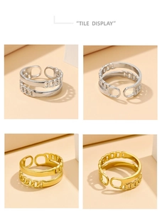 Detail of layered chain and smooth bands on adjustable gold and silver stainless steel rings