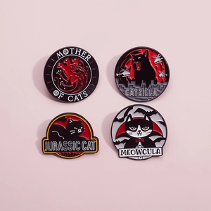 Detailed view of four black cat enamel pins with movie parody titles on pink background