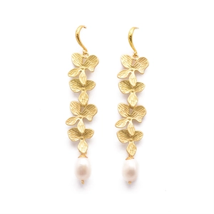 Elegant gold floral drop earrings with white teardrop pearls shown on white background