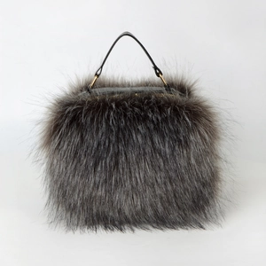 Chic faux raccoon fur crossbody handbag with gold hardware and plush top handle in grey
